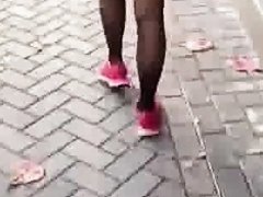 Asian woman walking like a frog